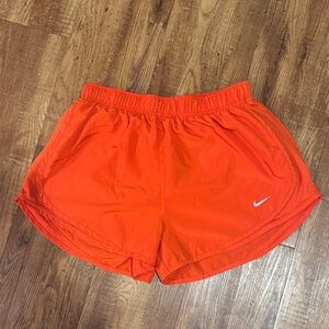 Nike Women's Bright Orange Athletic Shorts with Swoosh
